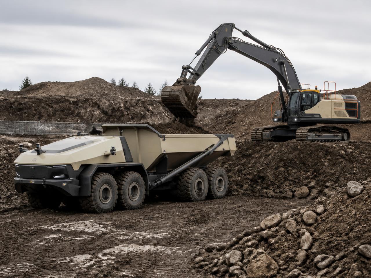 Autonomous heavy equipment operating across an outdoor earthworks site